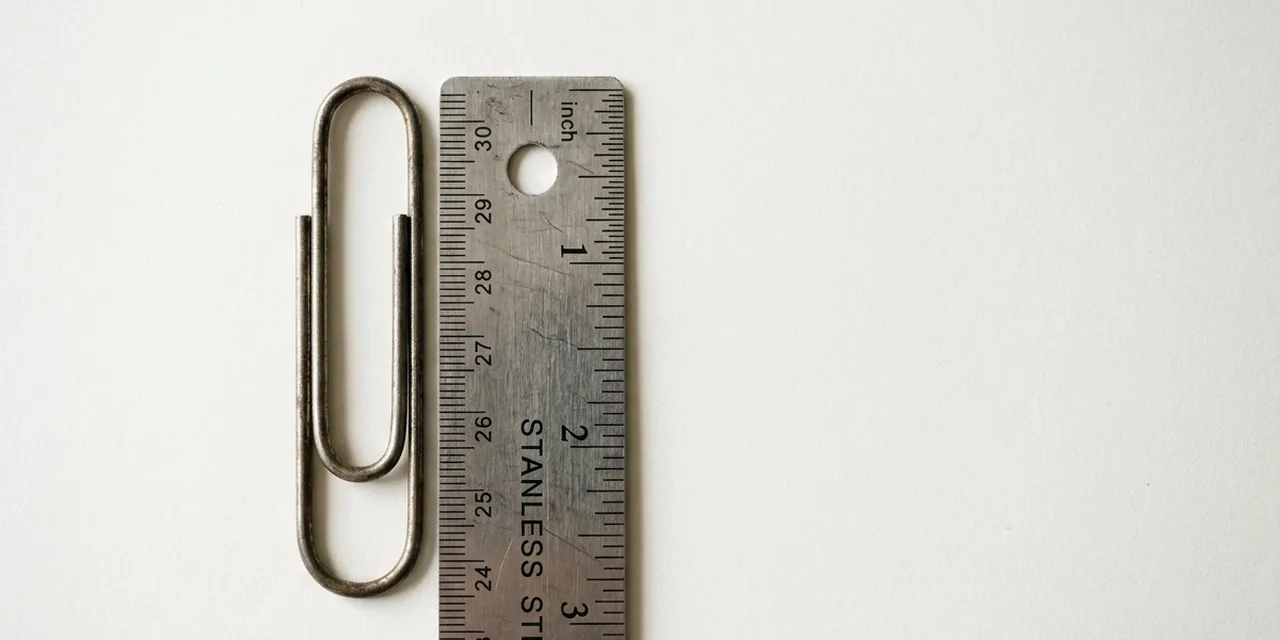 Small paperclip next to a steel ruler, measuring ~1.1 in (28 mm)