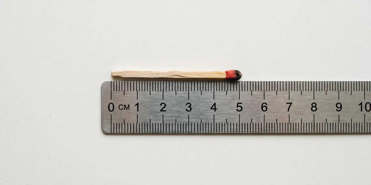 Matchstick next to a steel ruler, measuring ~2 in (50 mm)