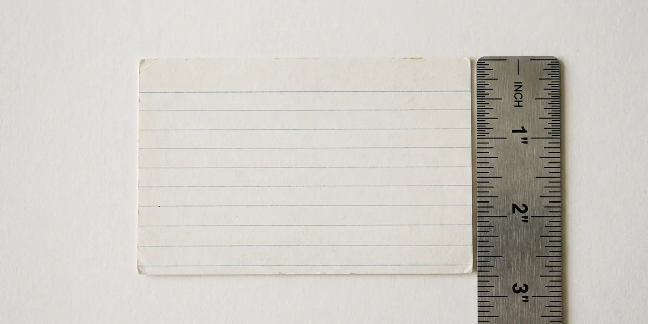 Index card next to a steel ruler, measuring 3 in (76 mm)